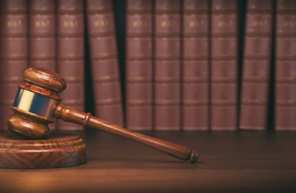 gavel-on-the-background-of-vintage-lawyer-books-concept-of-law-1-e1743871330588.jpg